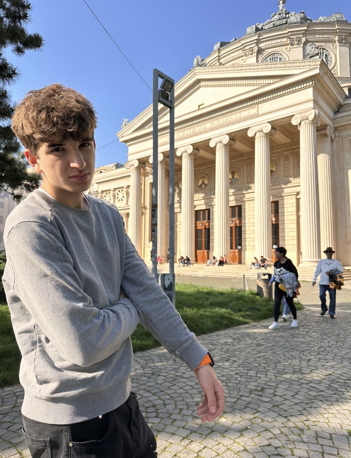 Vladislav in front of the Romanian Athenaeum in Bucharest